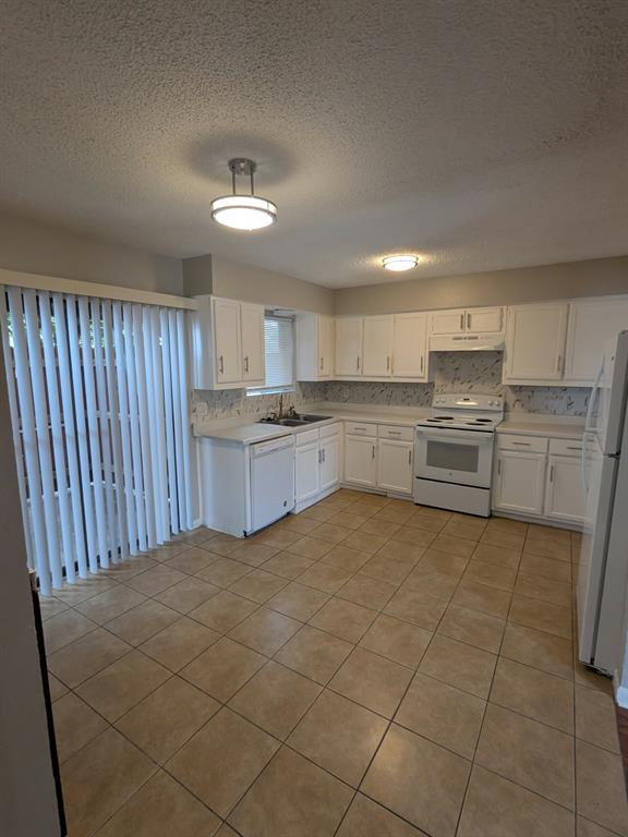 514 East Belt Line Road, Unit B13 DeSoto, TX 75115 - Photo 13 of 28 a kitchen with stainless steel appliances granite countertop a refrigerator oven a sink and dishwasher