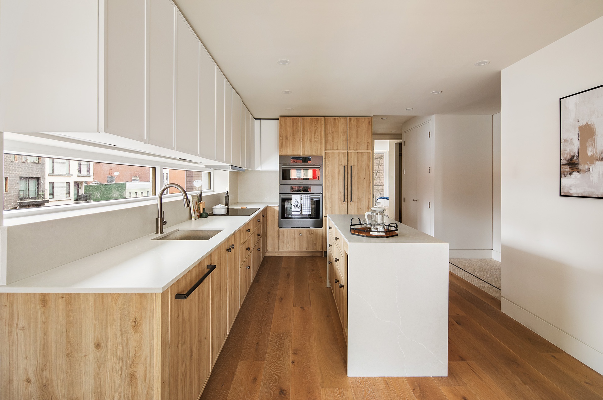 1110 Manhattan Avenue, Unit PH Brooklyn, NY 11222 - Photo 2 of 16 a kitchen with sink a counter top space and cabinets