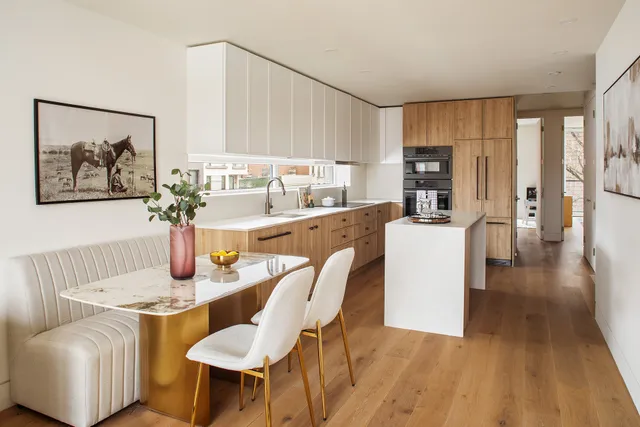 a dining room with furniture and wooden floor