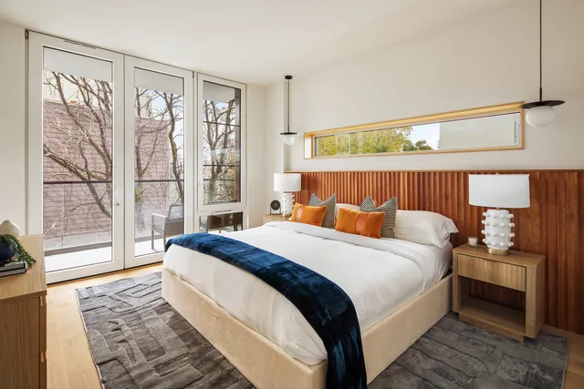 a bed room with a bed and a couch