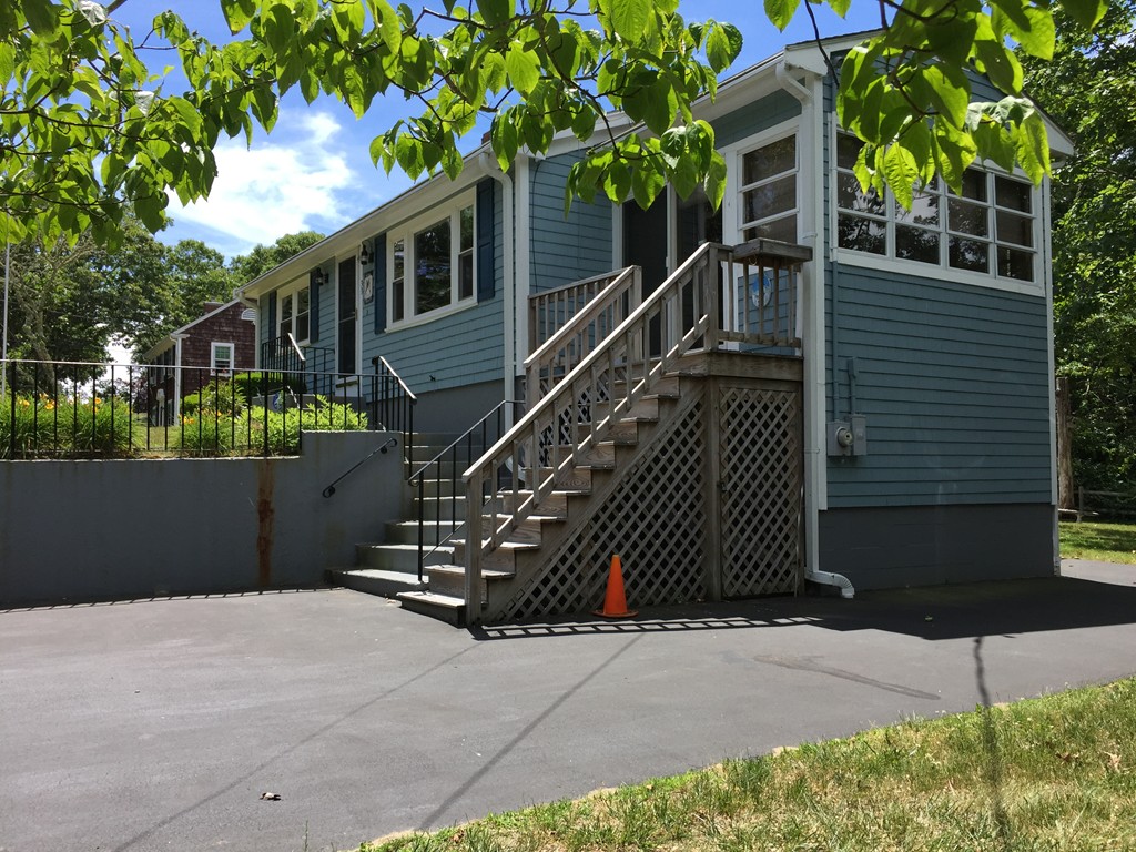 33 Robinwood Road Wareham, MA 02532 - Photo 1 of 13 a front view of a house with a yard