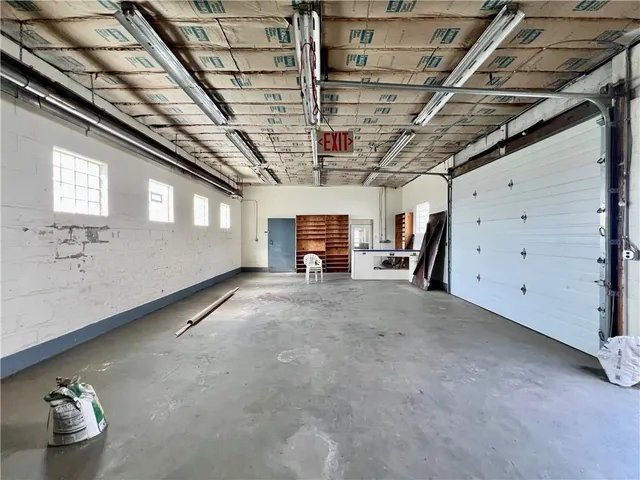 a view of empty room with wooden ceiling