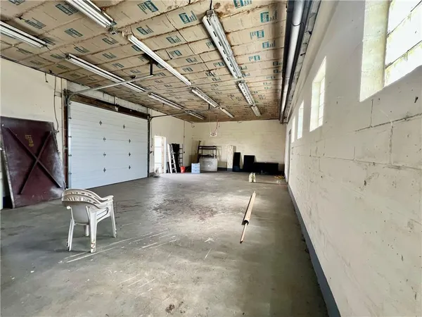 a work room with furniture and a window