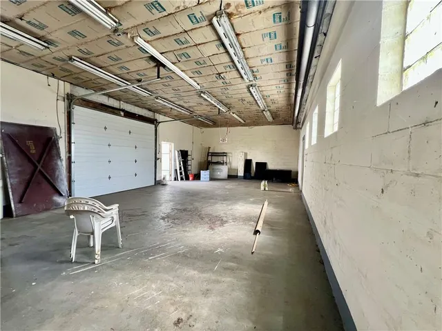 a work room with furniture and a window