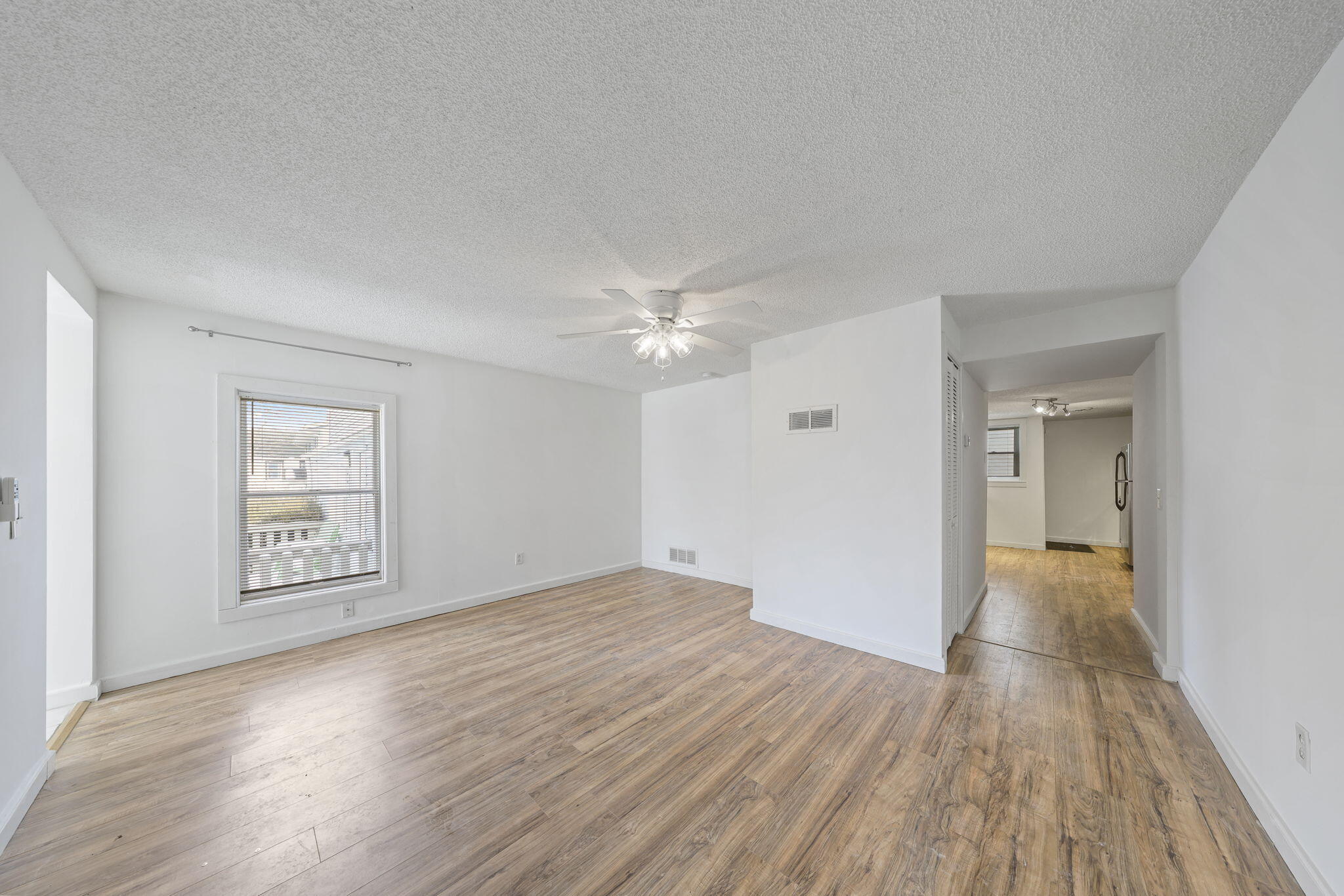 361 Locust Street, Unit 4 Valparaiso, IN 46383 - Photo 2 of 10 wooden floor in an empty room with a window