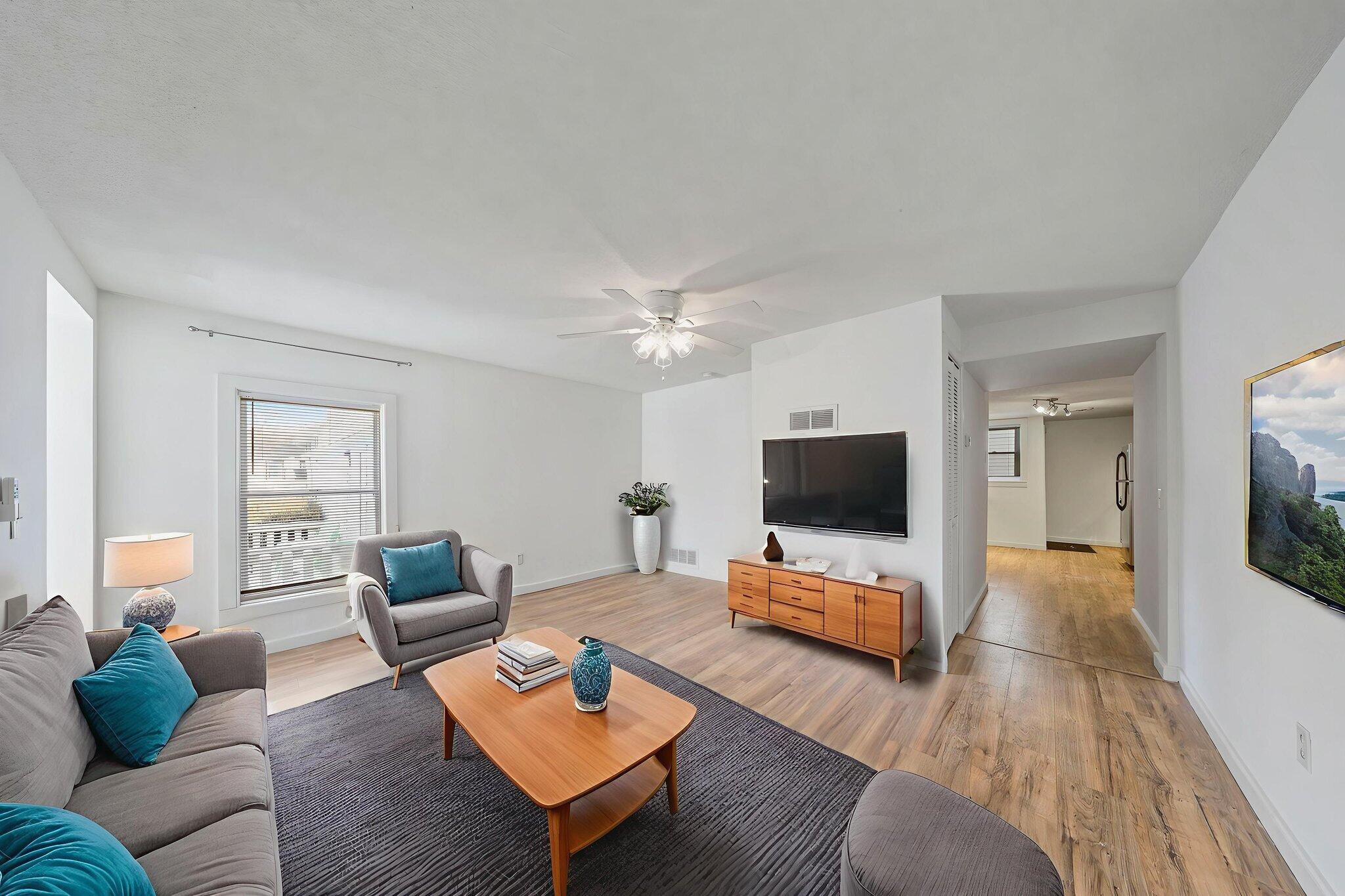 361 Locust Street, Unit 4 Valparaiso, IN 46383 - Photo 3 of 10 a living room with furniture and a flat screen tv