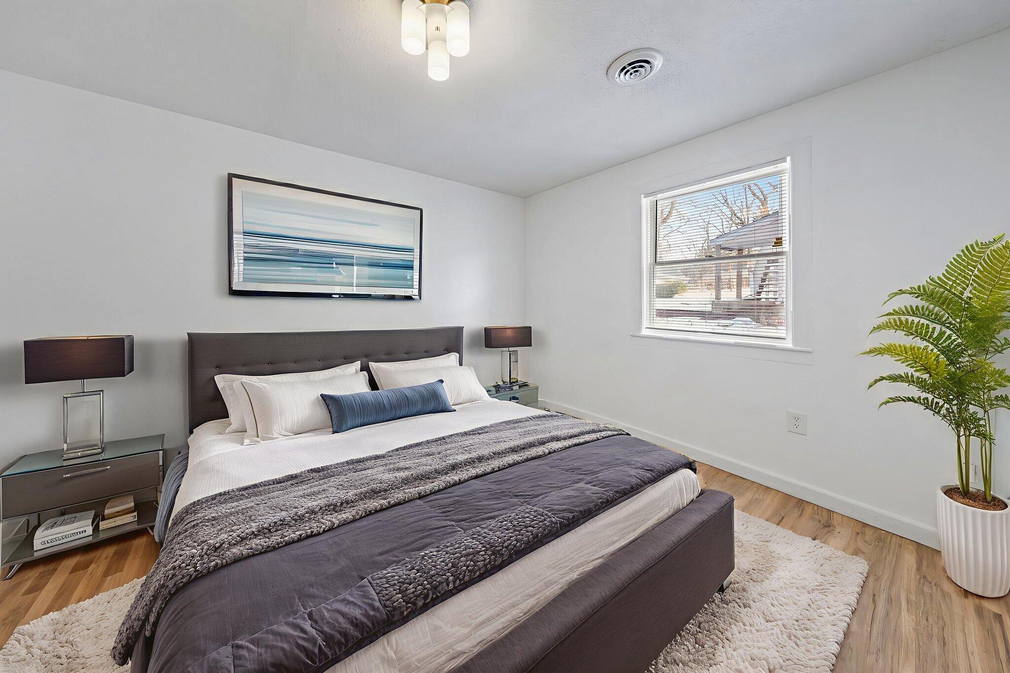 361 Locust Street, Unit 4 Valparaiso, IN 46383 - Photo 8 of 10 a bedroom with bed plant and window