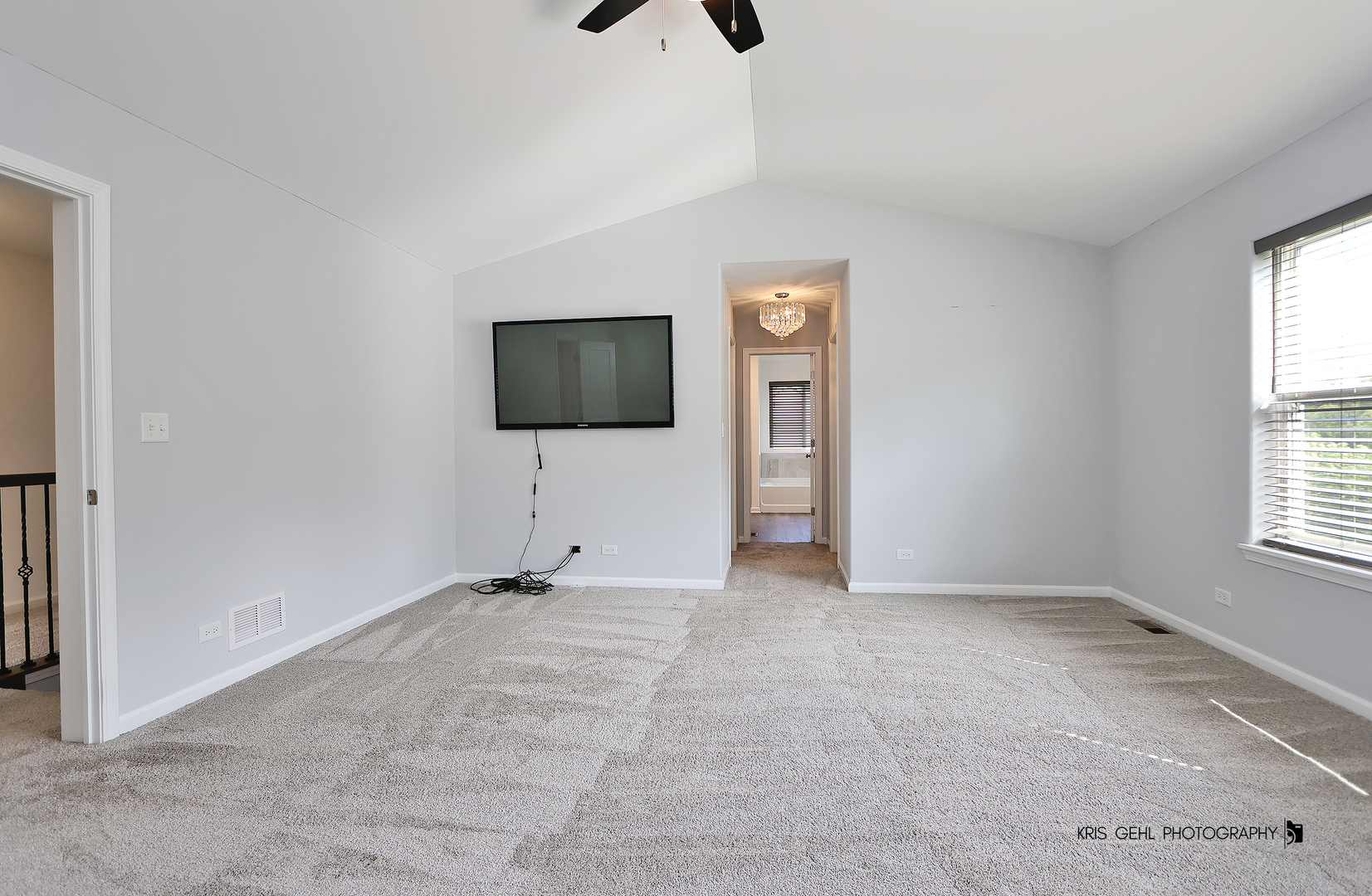 10718 Hunt Club Road Richmond, IL 60071 - Photo 14 of 28 an empty room with windows and flat screen tv