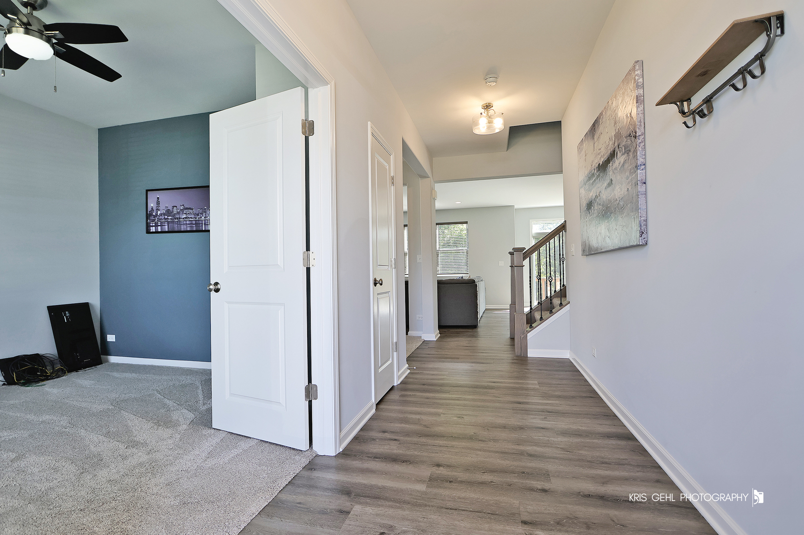 10718 Hunt Club Road Richmond, IL 60071 - Photo 2 of 28 a view of a hallway with wooden floor and staircase
