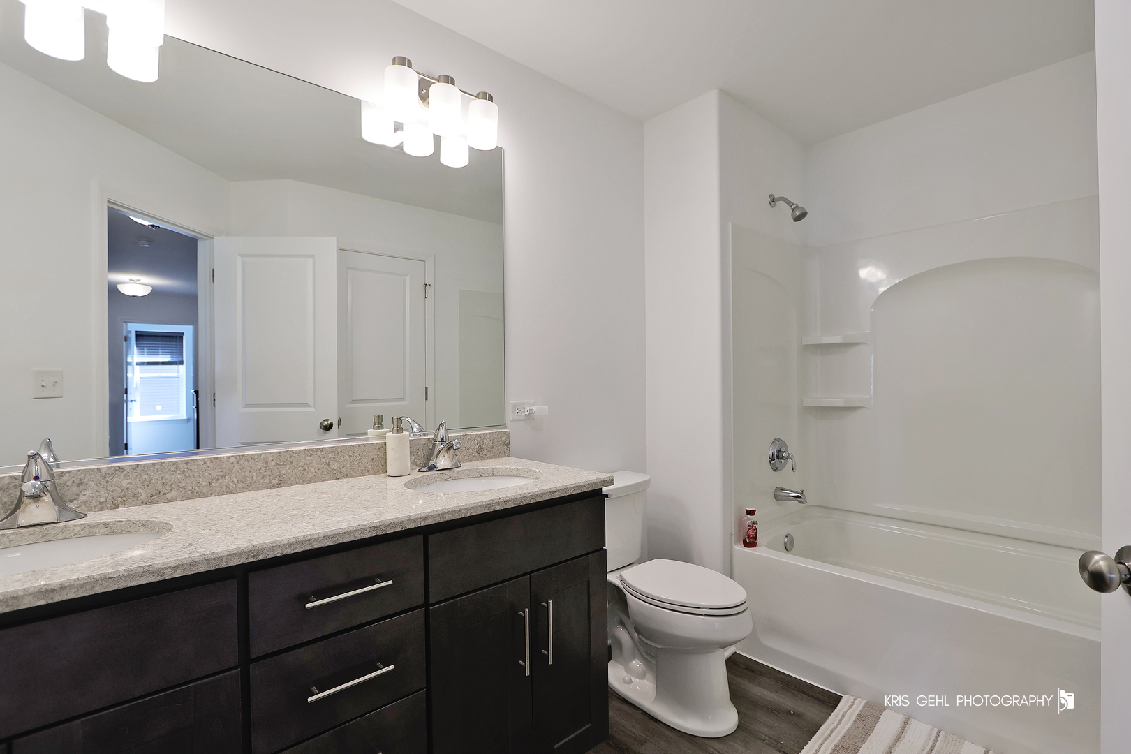 10718 Hunt Club Road Richmond, IL 60071 - Photo 21 of 28 a bathroom with a sink a toilet and shower