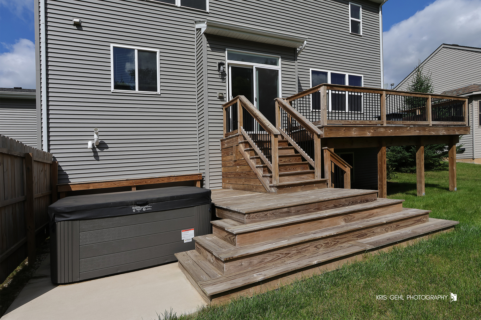 10718 Hunt Club Road Richmond, IL 60071 - Photo 26 of 28 a view of a house with a small deck and a large window
