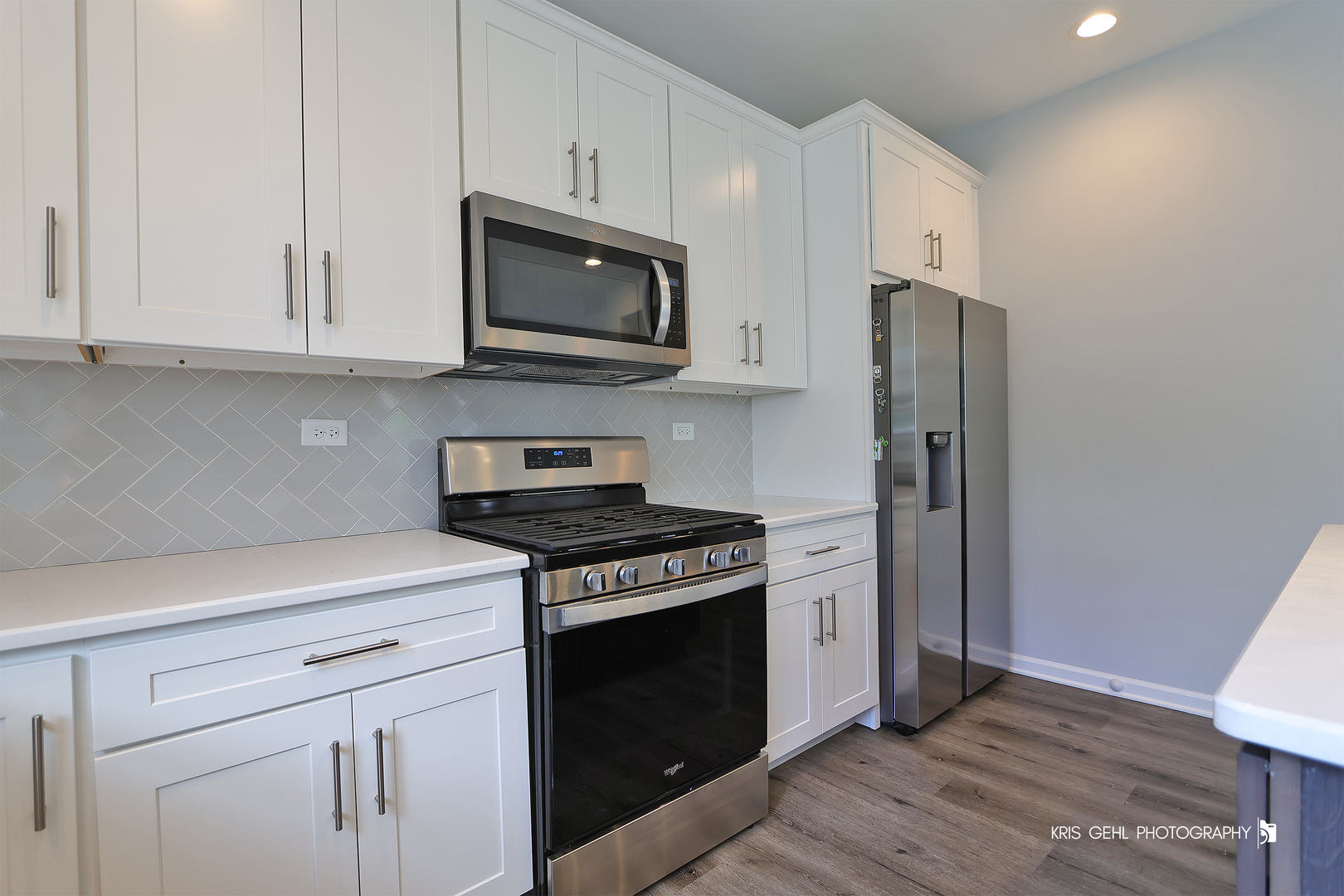 10718 Hunt Club Road Richmond, IL 60071 - Photo 9 of 28 a kitchen with stainless steel appliances white cabinets white stove a sink and dishwasher