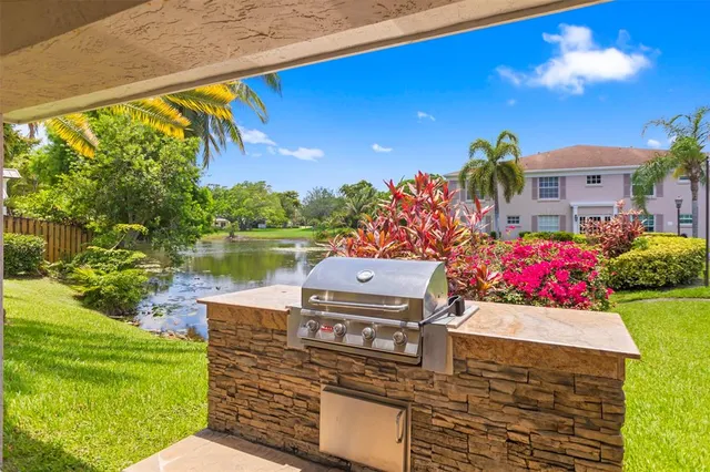 a view of a sitting area with swimming pool and garden view