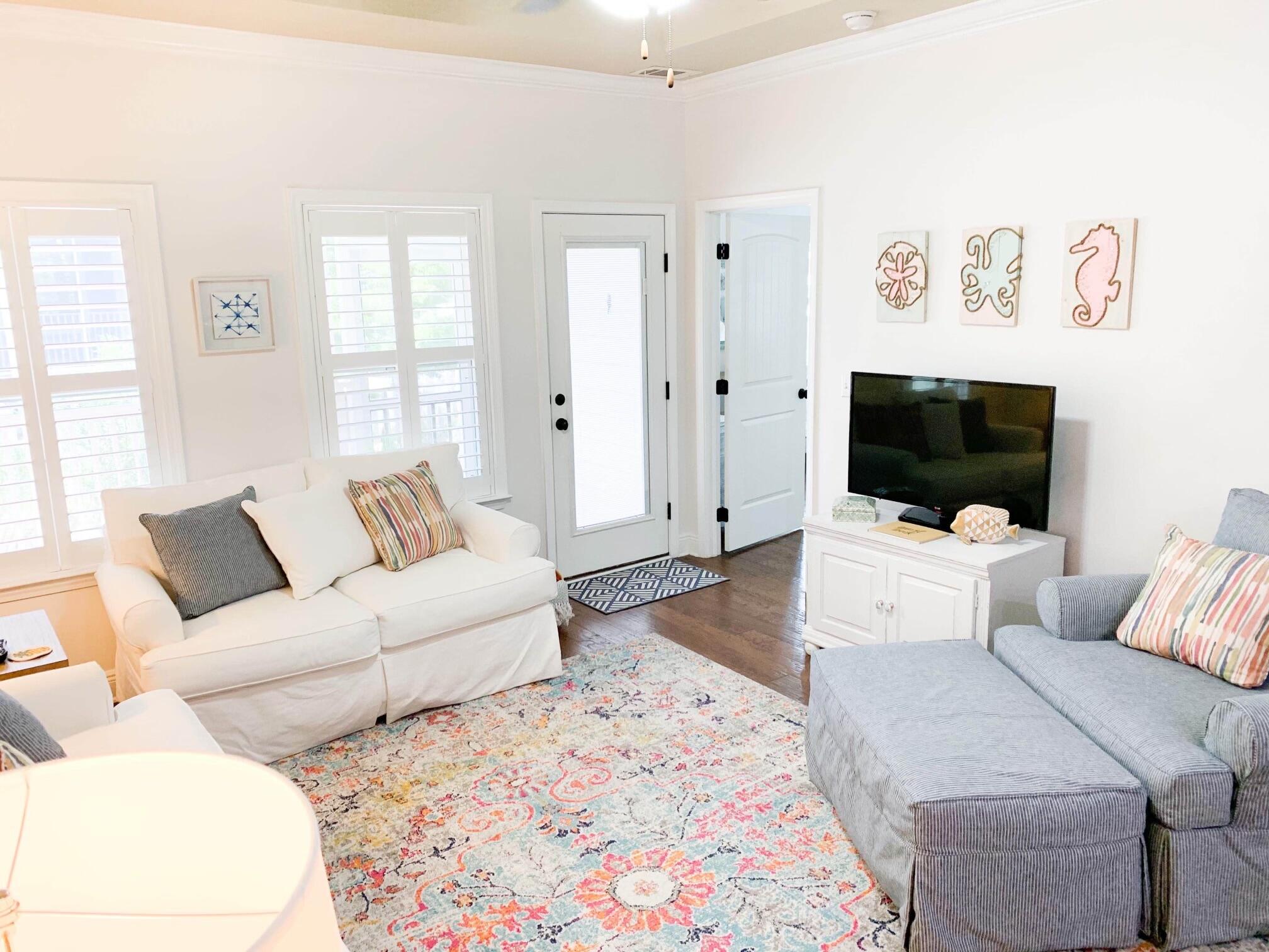 184 Golf Villa Drive Santa Rosa Beach, FL 32459 - Photo 12 of 24 a living room with furniture and a flat screen tv
