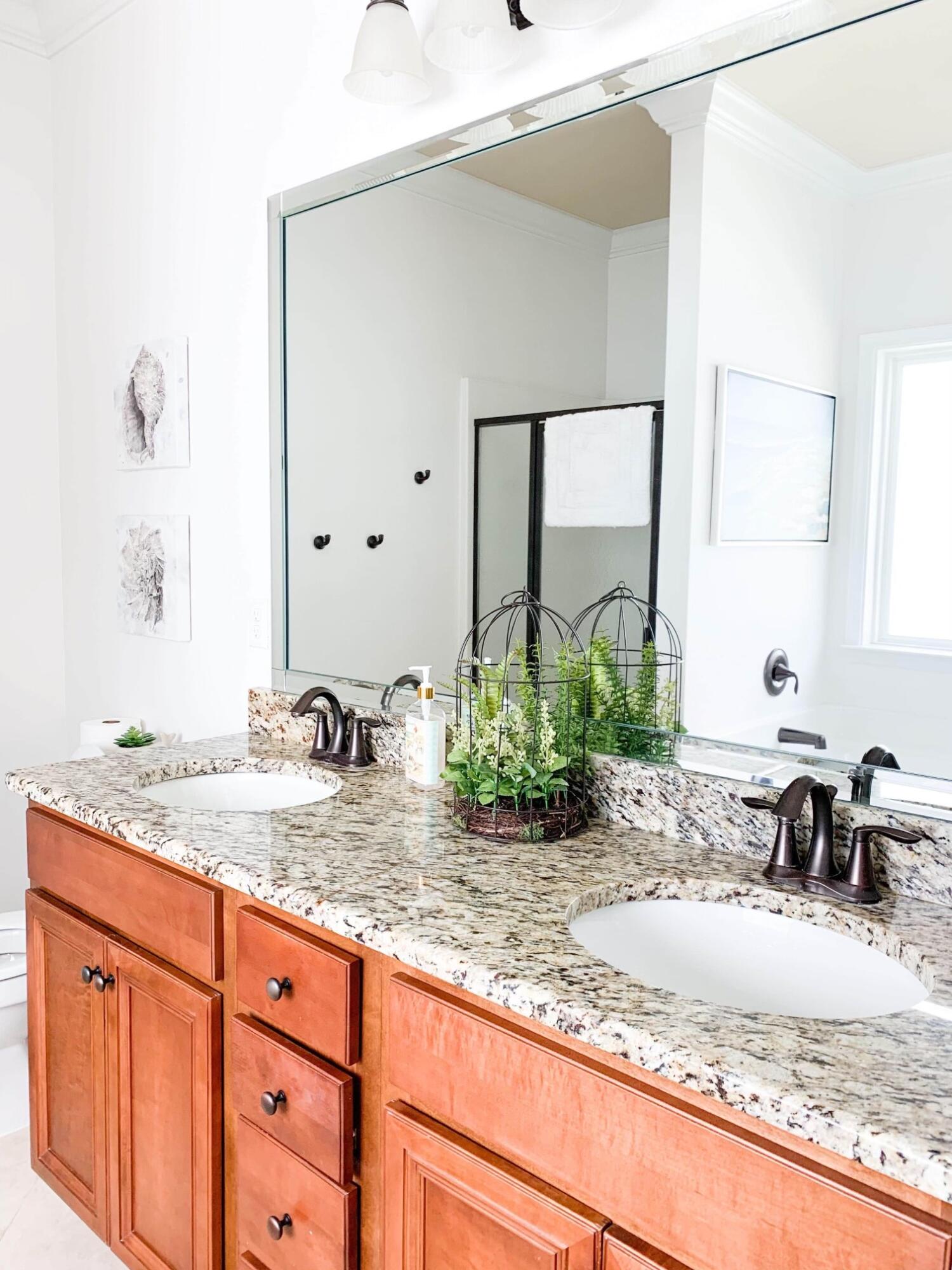 184 Golf Villa Drive Santa Rosa Beach, FL 32459 - Photo 15 of 24 a bathroom with a granite countertop sink and a mirror