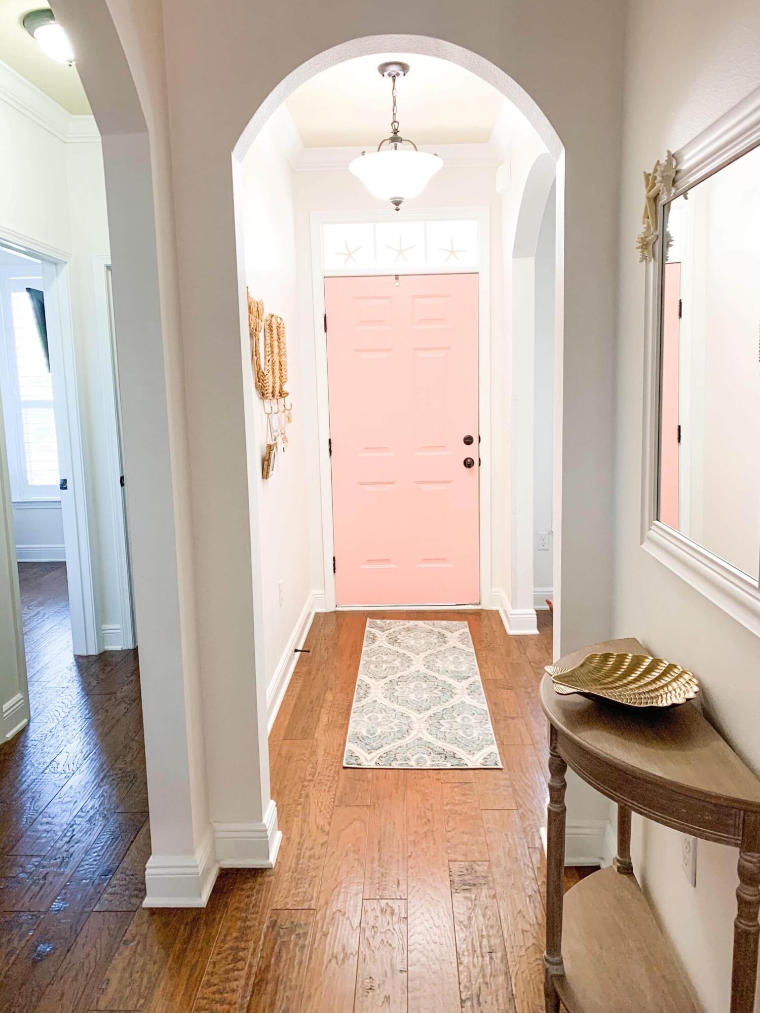 184 Golf Villa Drive Santa Rosa Beach, FL 32459 - Photo 6 of 24 a view of a hallway view with wooden floor and dining room