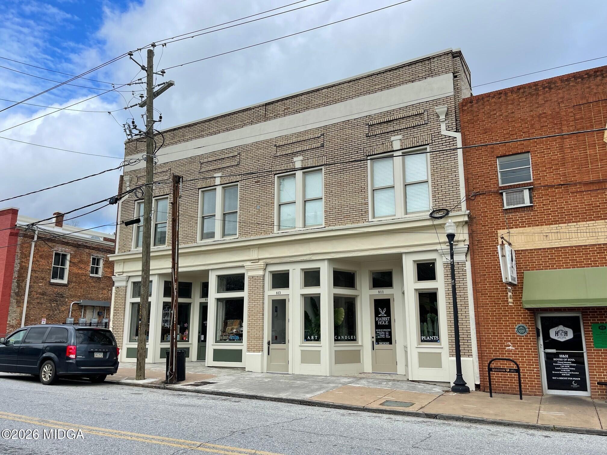813 Forsyth Street, Unit C Macon, GA 31201 - Photo 2 of 6 a cars parked in front of a building