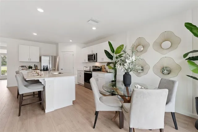 a kitchen with a sink and refrigerator