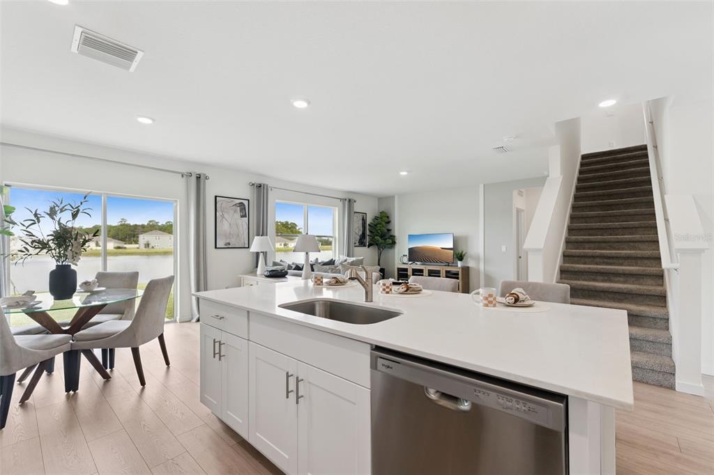 2833 House Finch Road St. Cloud, FL 34773 - Photo 19 of 70 a kitchen with sink and view of living room