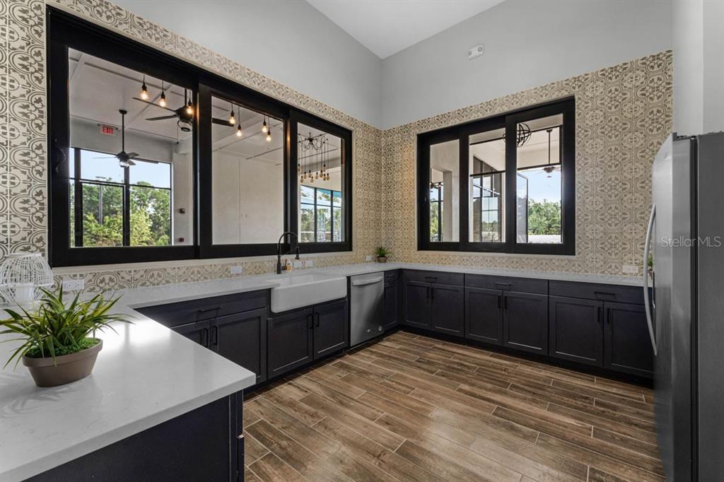 2833 House Finch Road St. Cloud, FL 34773 - Photo 41 of 70 a kitchen with a sink and large window