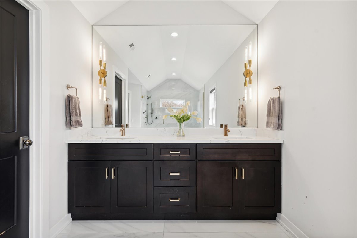 761 County Line Road Highland Park, IL 60035 - Photo 18 of 36 a bathroom with a granite countertop sink a vanity and a large mirror