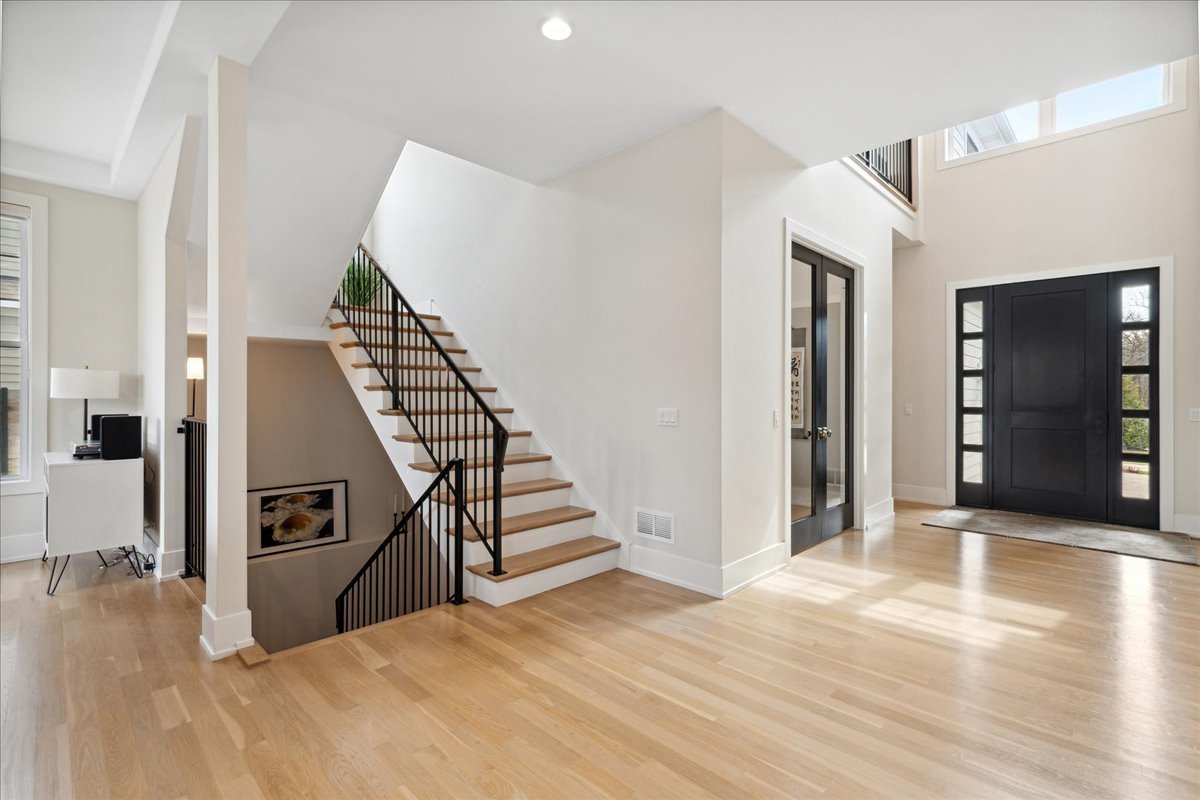 761 County Line Road Highland Park, IL 60035 - Photo 4 of 36 a view of a livingroom with wooden floor and stairs
