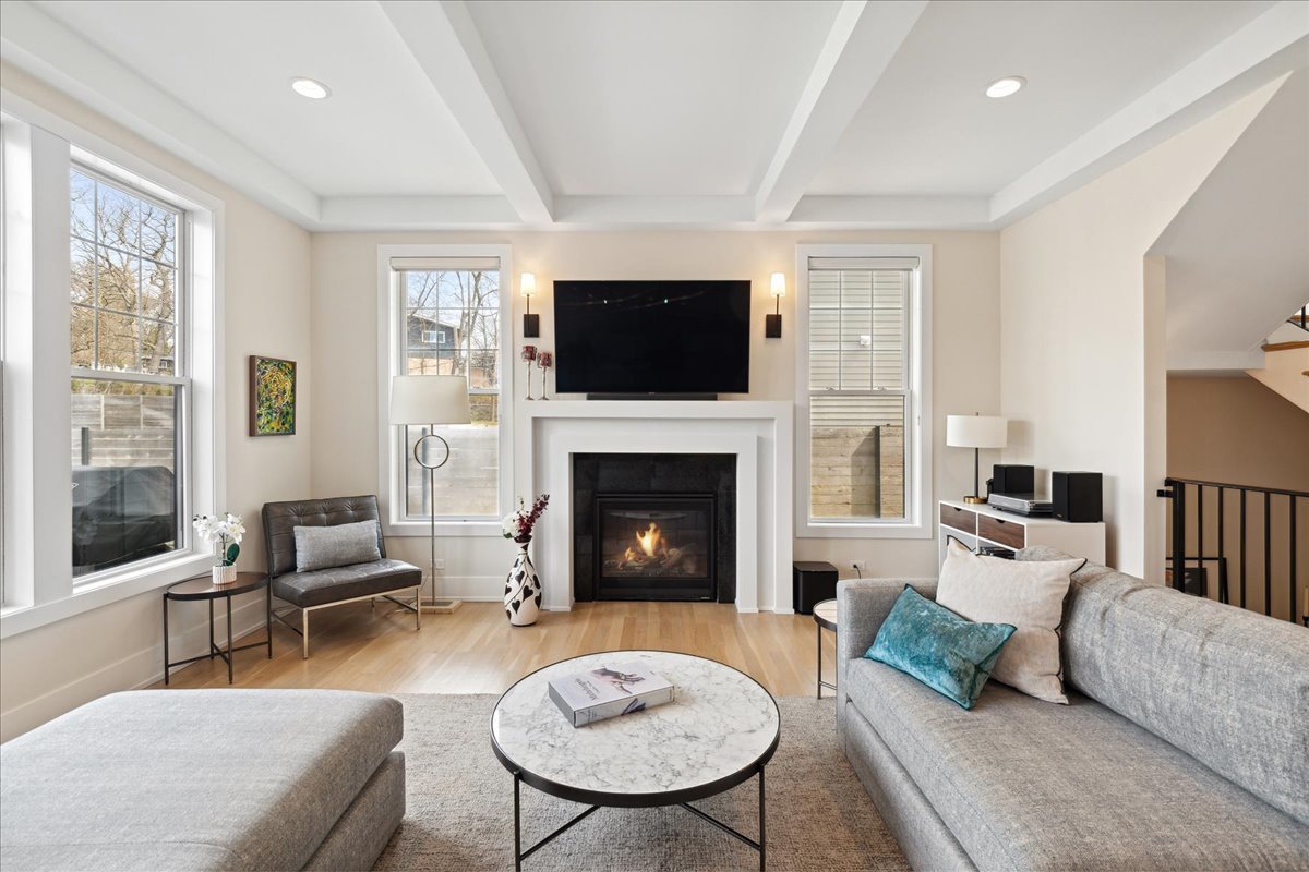 761 County Line Road Highland Park, IL 60035 - Photo 8 of 36 a living room with furniture a flat screen tv and a fireplace