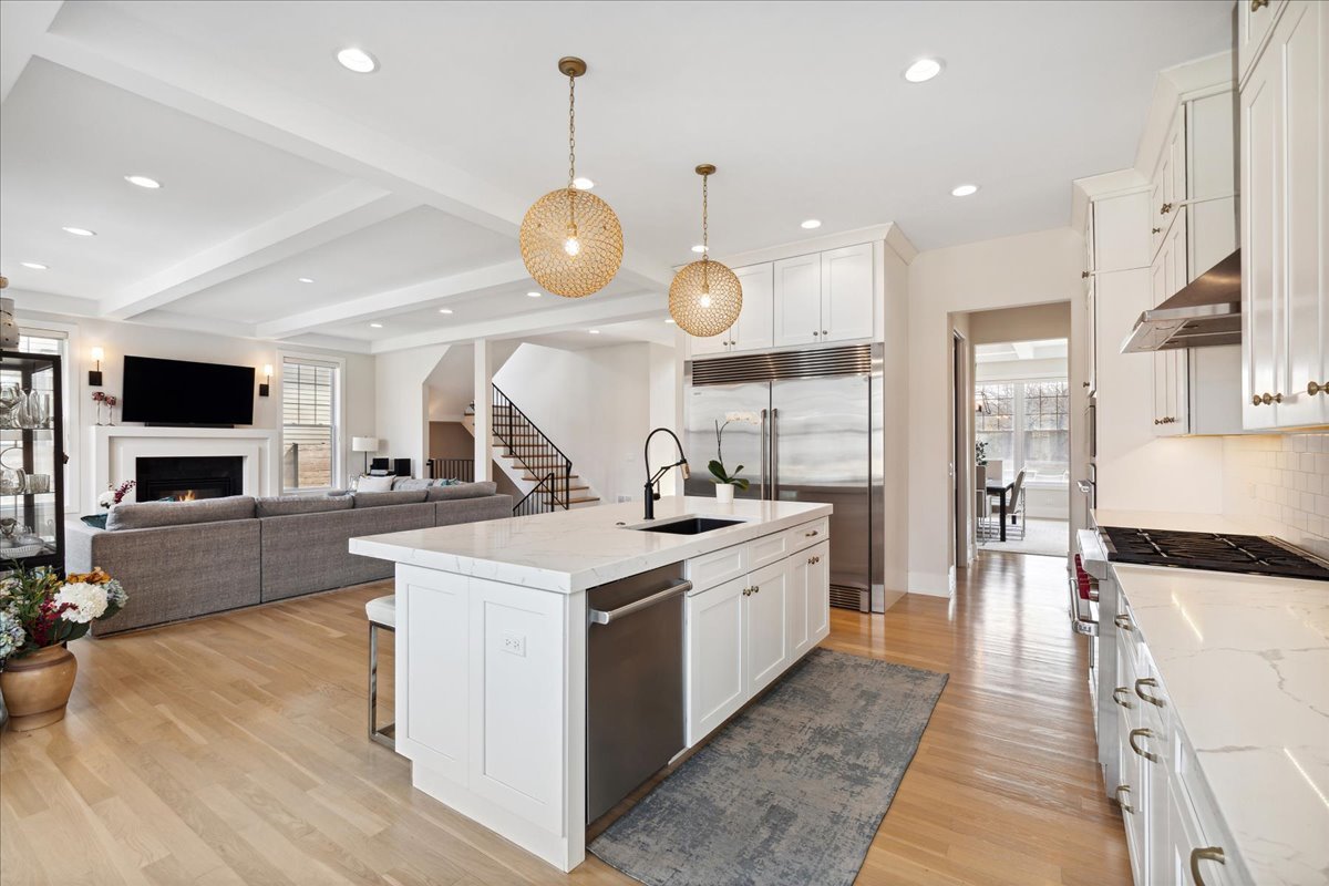 761 County Line Road Highland Park, IL 60035 - Photo 10 of 36 a large kitchen with stainless steel appliances granite countertop a stove and a view of living room