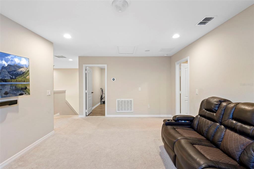3937 Ceremony Cove Sanford, FL 32771 - Photo 19 of 51 a living room with furniture and a flat screen tv
