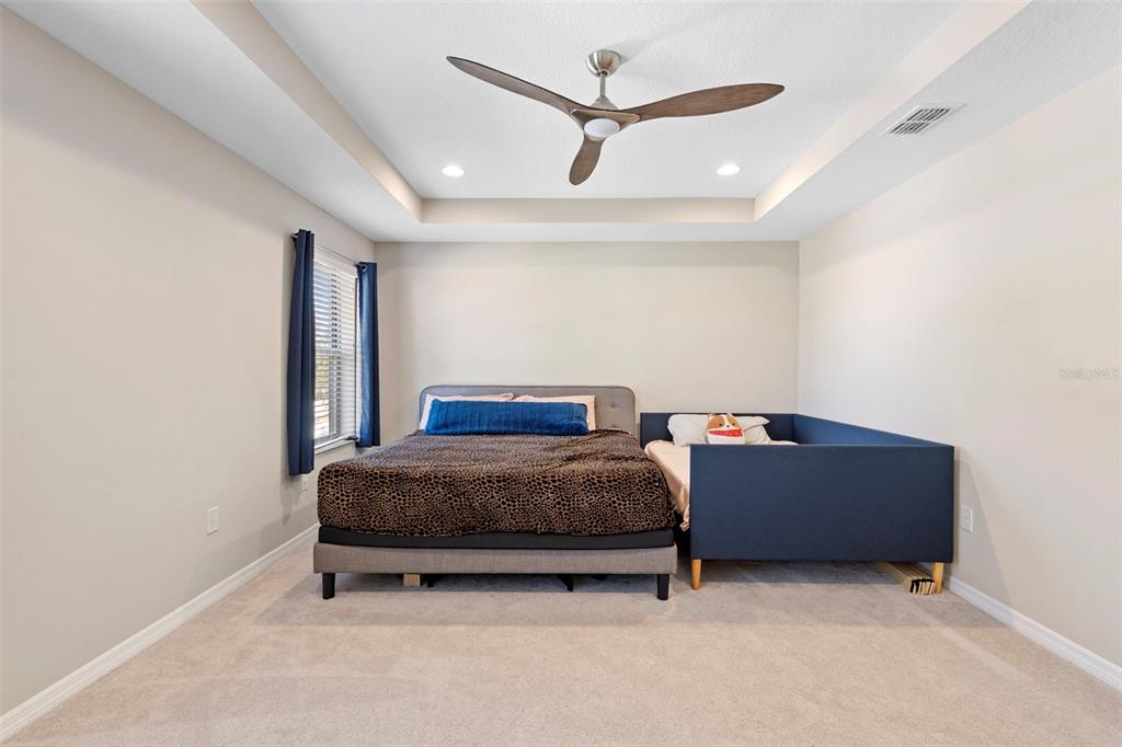 3937 Ceremony Cove Sanford, FL 32771 - Photo 21 of 51 a room with bed and a ceiling fan
