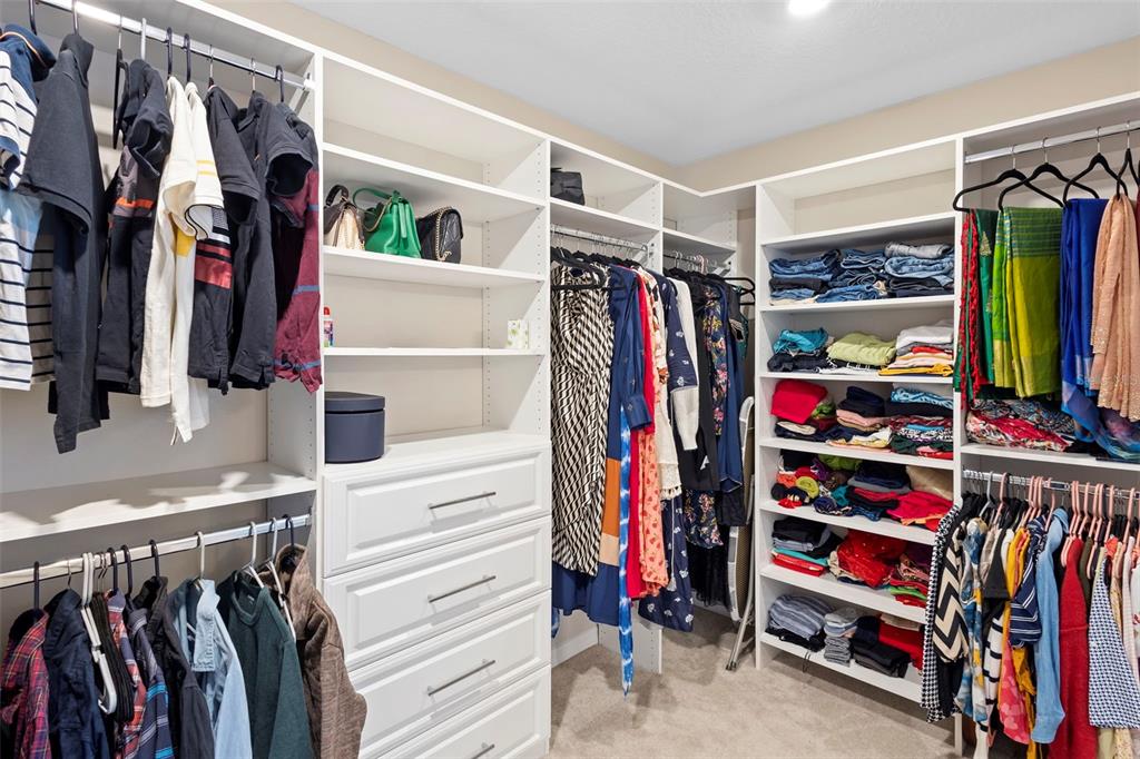 3937 Ceremony Cove Sanford, FL 32771 - Photo 27 of 51 a view of walk in closet with clothes