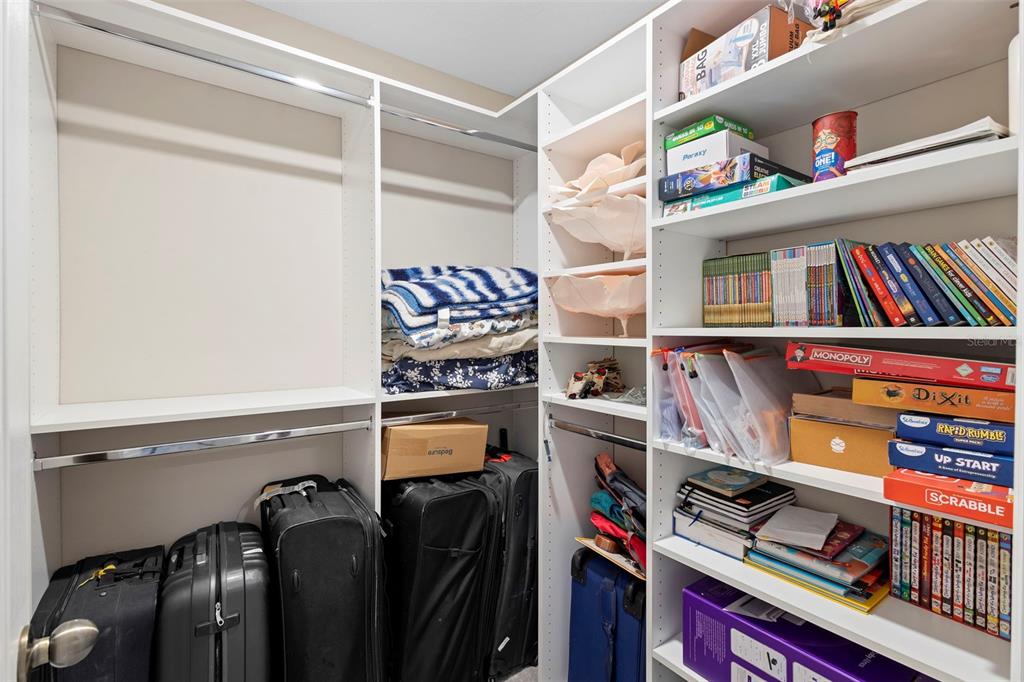 3937 Ceremony Cove Sanford, FL 32771 - Photo 30 of 51 a room with furniture and a book shelf