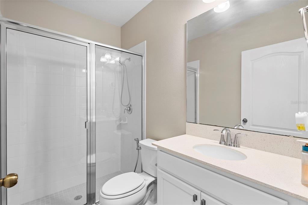 3937 Ceremony Cove Sanford, FL 32771 - Photo 34 of 51 a bathroom with a sink toilet and shower
