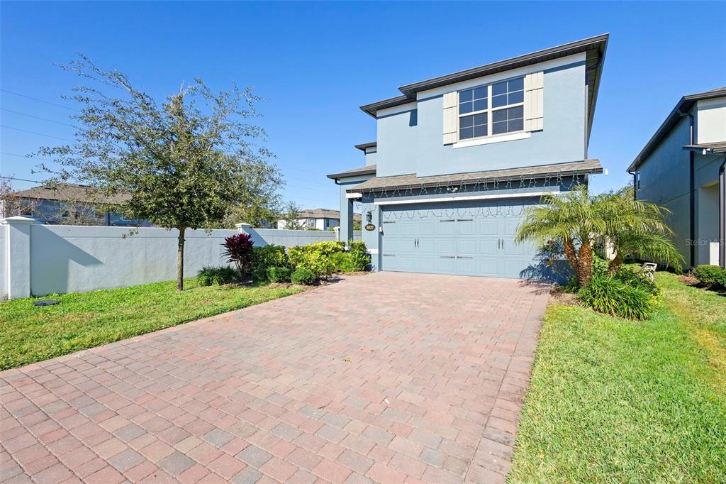 3937 Ceremony Cove Sanford, FL 32771 - Photo 40 of 51 a front view of a house with a yard and a garage