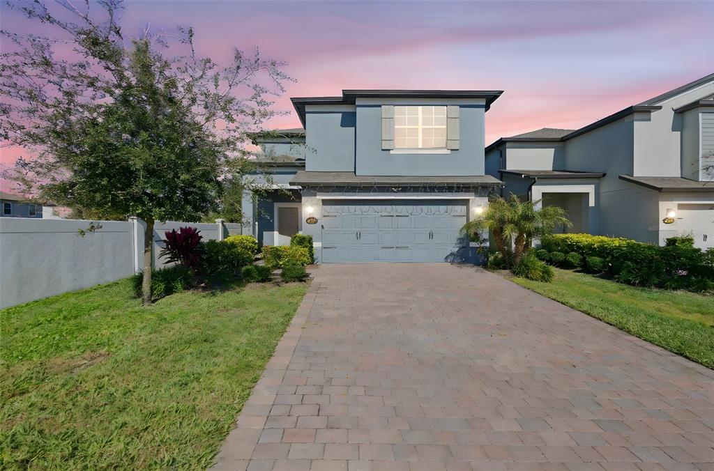 3937 Ceremony Cove Sanford, FL 32771 - Photo 41 of 51 a front view of a house with a yard and a garage
