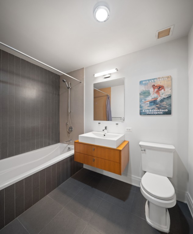 124 West 24th Street, Unit 2B Manhattan, NY 10011 - Photo 6 of 7 a bathroom with a sink a toilet and shower