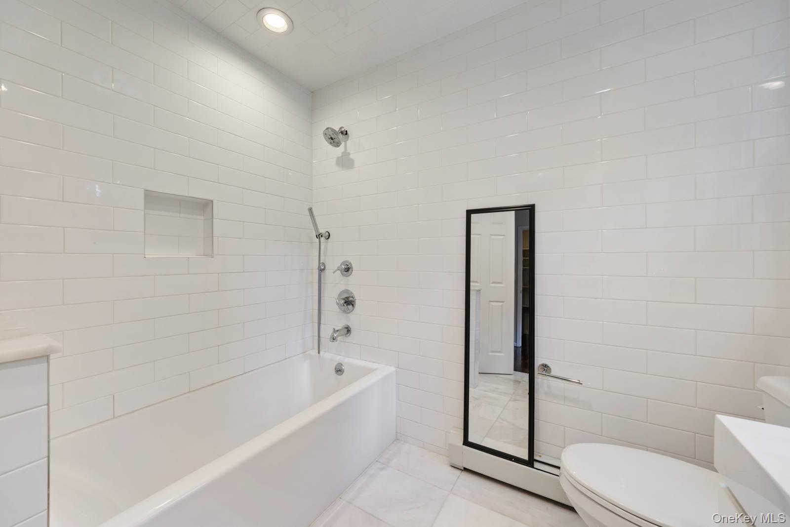 10 Demarest Road Spring Valley, NY 10977 - Photo 37 of 39 a bathroom with a bathtub and toilet