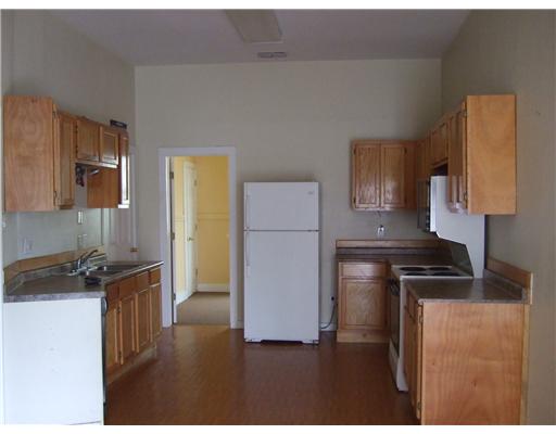 2580 5th Street, Unit 2 Ingleside, TX 78362 - Photo 2 of 2 a kitchen with a refrigerator and a stove