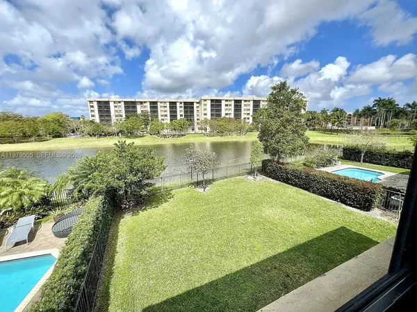 a view of a lake with a yard