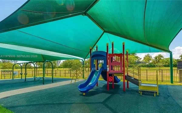 a view of a park with a slide