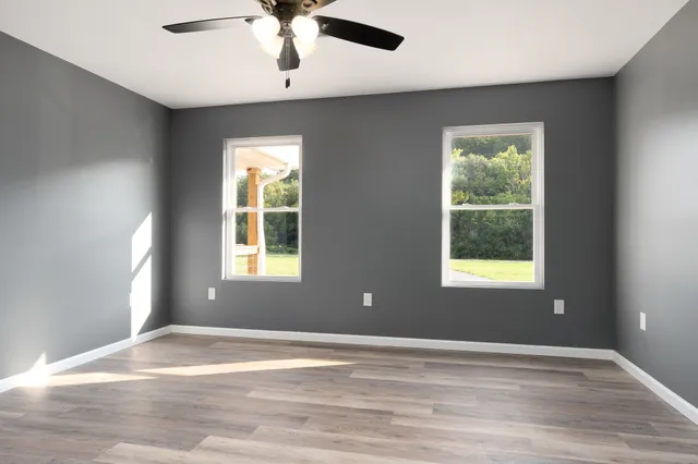 a view of an empty room with a window