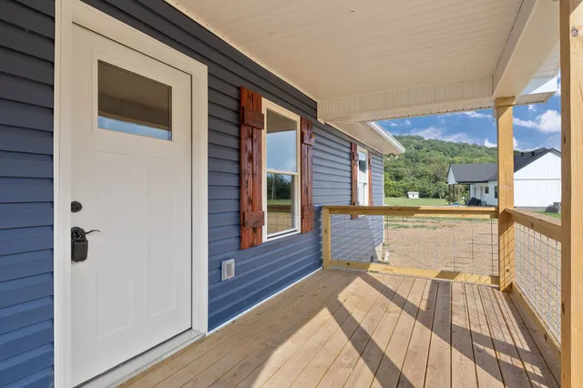 a view of outdoor space with swimming pool and green