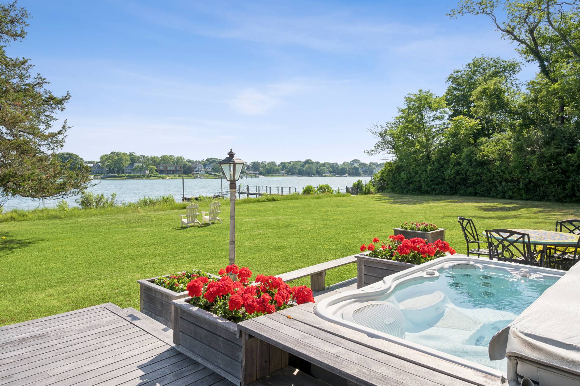 69 Ferry Road Sag Harbor, NY 11963 - Photo 6 of 17 a view of a chairs and table on the terrace