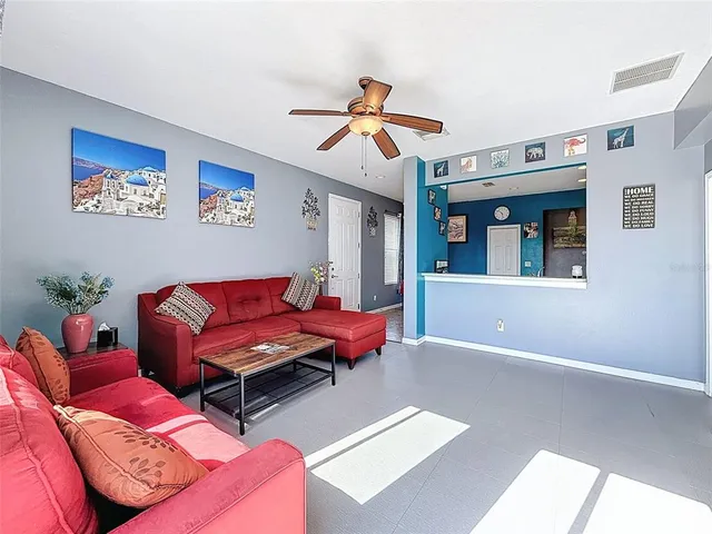 a living room with furniture and a window