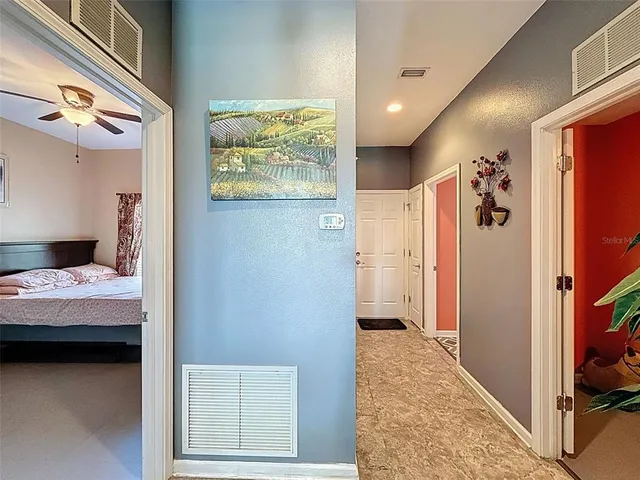 a bedroom with a bed and a couch