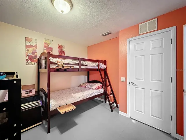 an aerial view of a house with a garden and a yard