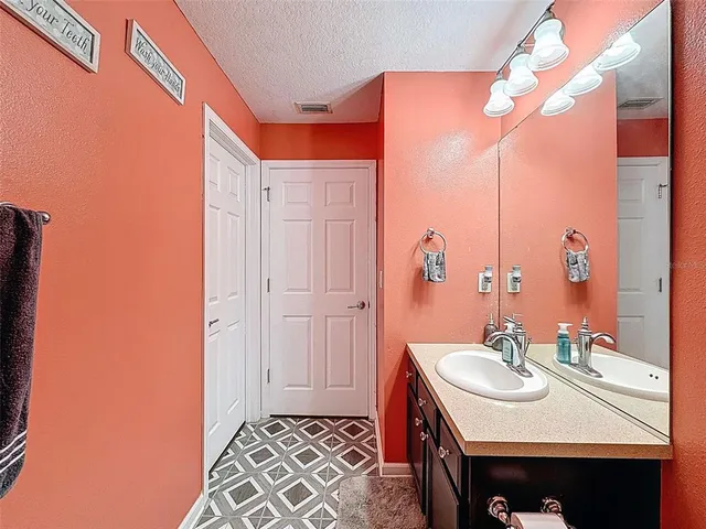 an aerial view of residential houses with outdoor space and swimming pool