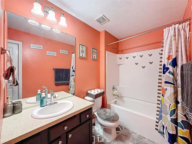 an aerial view of a house with a big yard