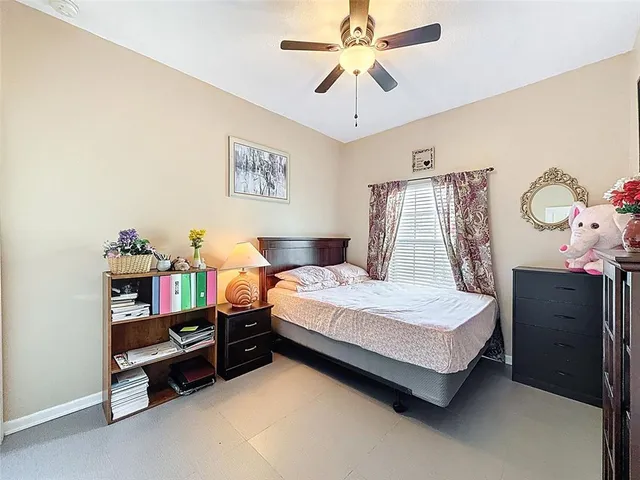 an aerial view of multiple houses with a yard