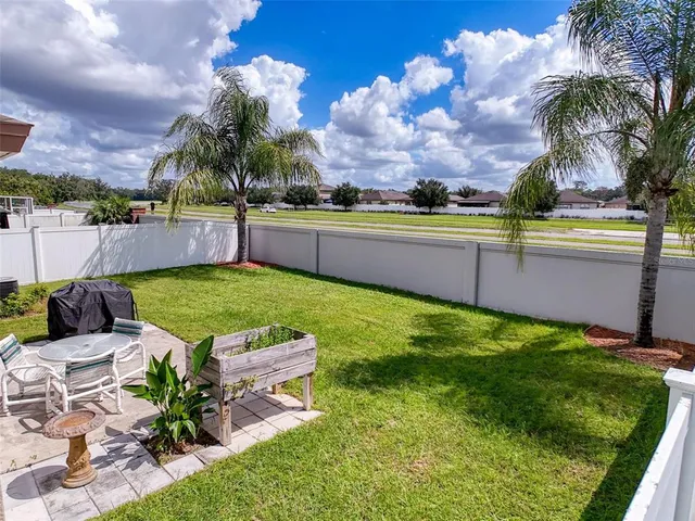 a house view with a sitting space garden and swimming pool